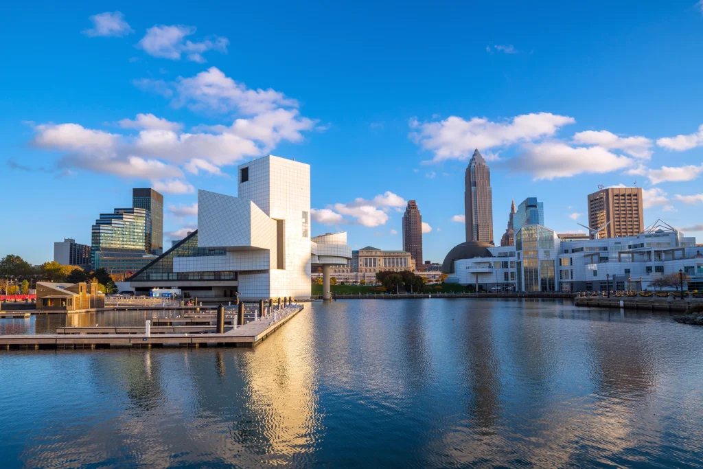 Cleveland city skyline and waterfront real estate scene under blue sky, highlighting opportunities for Investing in U.S. Real Estate